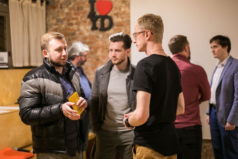 A group standing and talking after the pitches